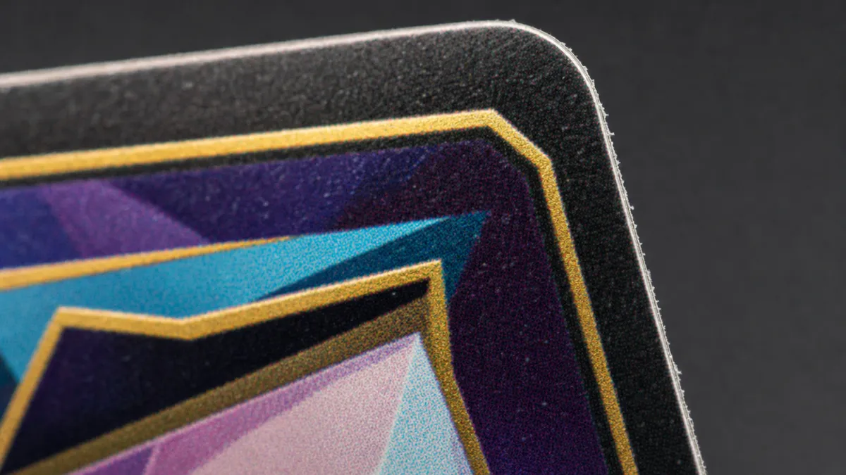 The same detail with typical replica flaws: crooked stitching, glue residue, rough edges